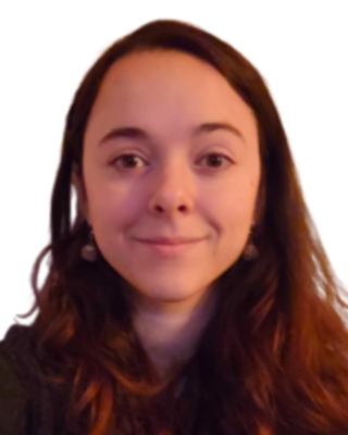 Female with below shoulder length brown hair, headshot image.